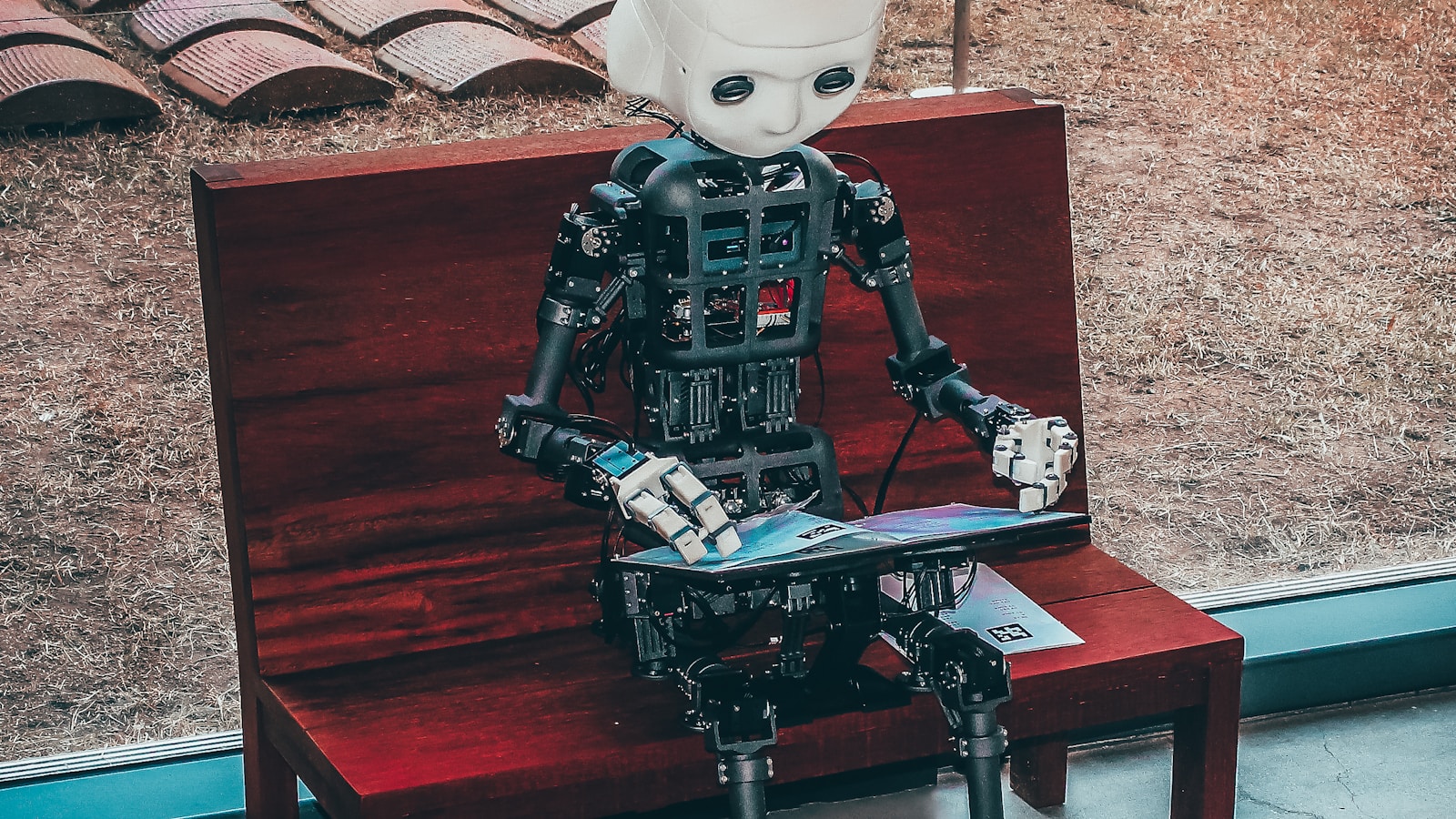 Laptop running AI assistant interface on a clean desk