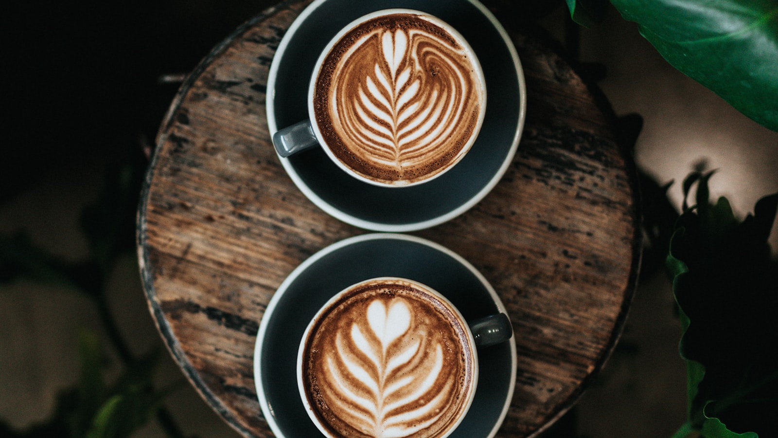 Pour-over coffee dripping into a glass server in a sunny kitchen