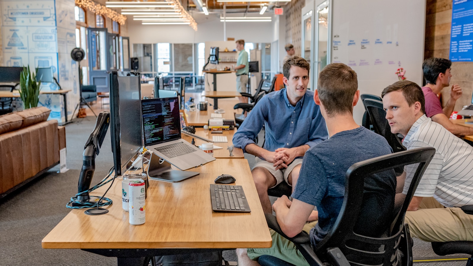 Entrepreneur planning a side business with notebook and laptop