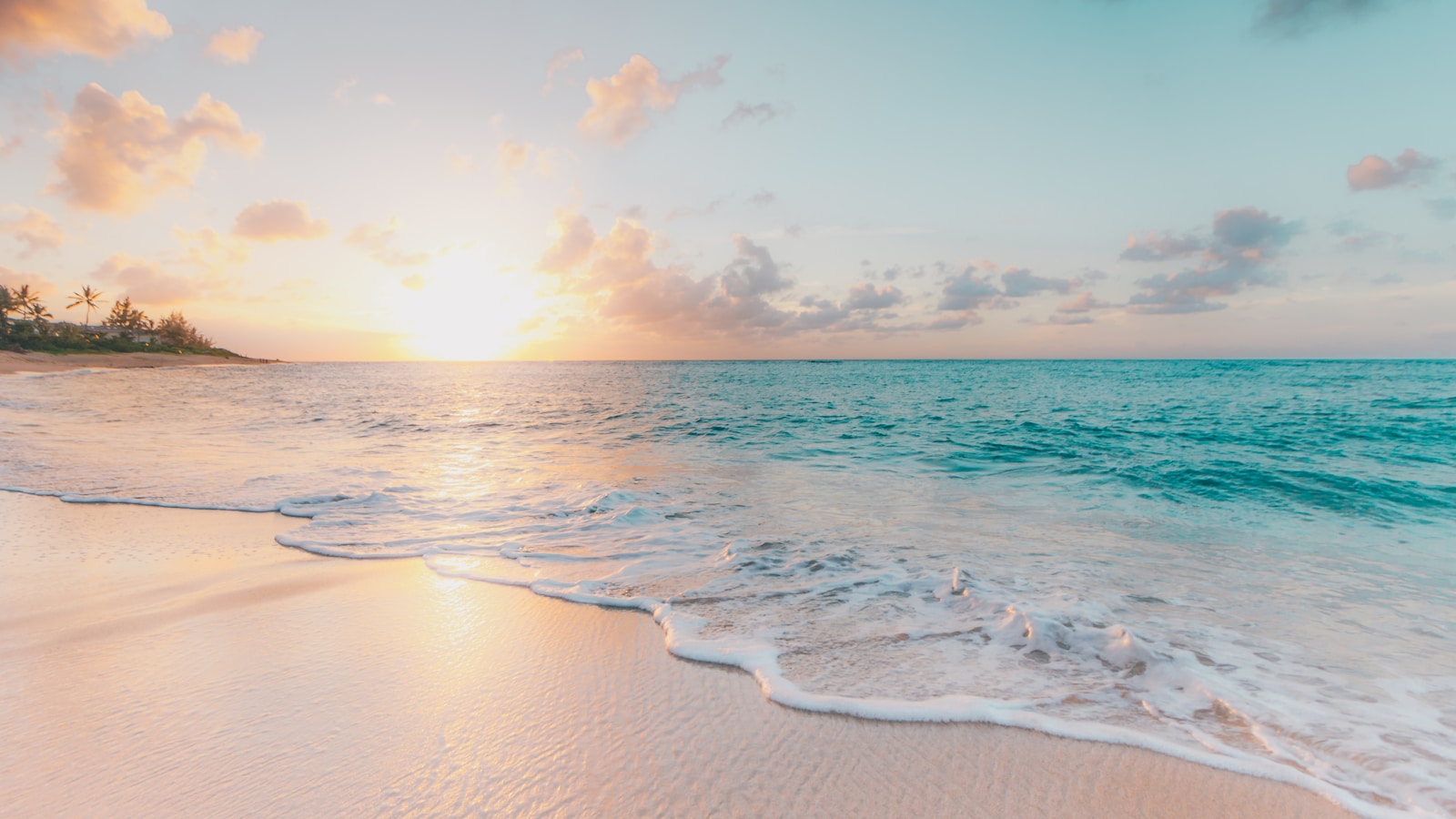 Couple watching a sunset from a quiet beach overlook