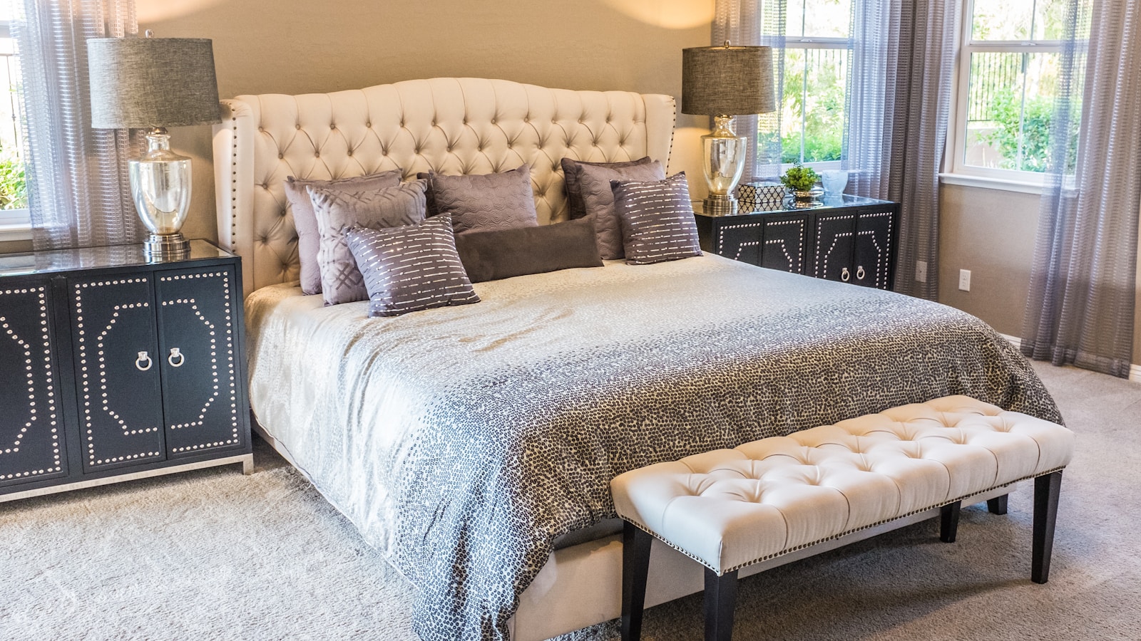 Cozy bedroom with soft morning light and made bed