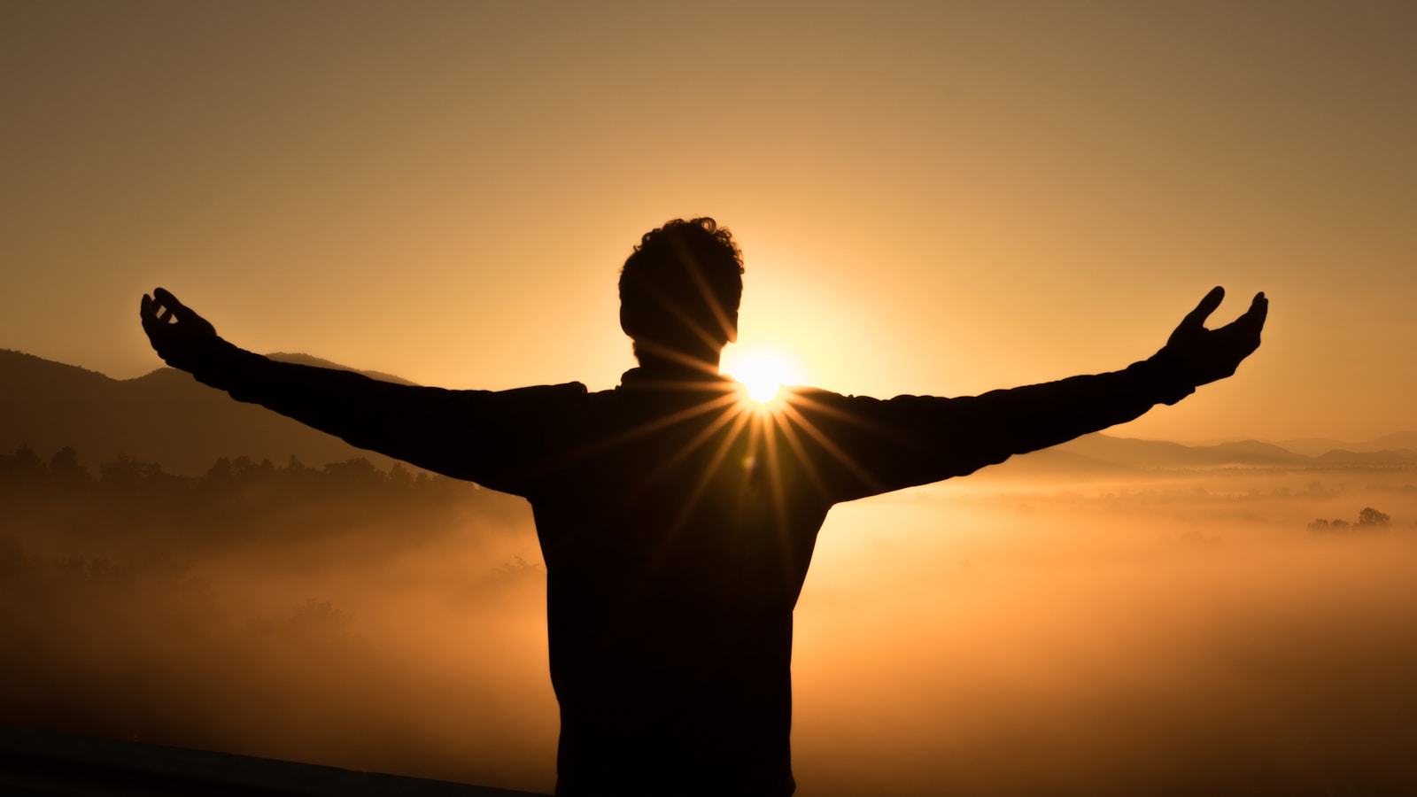 Person practising slow breathing in a calm room with soft light
